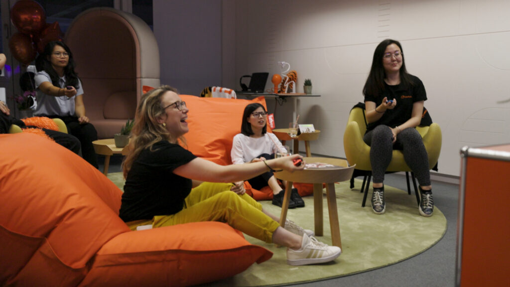 Image of the PlayRoom in FunPlus Office in Zug. FunPlus Team members playing games.